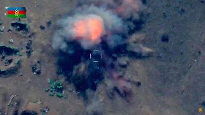 Azerbaijan forces strike what they say is an Armenian position in the Nagorno-Karabakh region. EPA screengrab of video released by Azerbaijan Defence Ministry