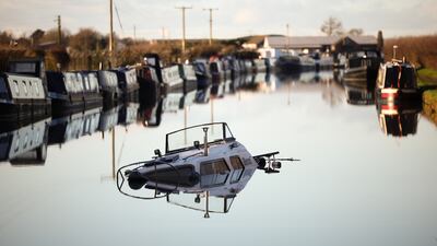 A sunken boat on the Bridgewater Canal, after heavy rain caused part of the bank to collapse, in Little Bollington, north-west England. EPA