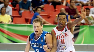 Roberto Vercellino of Italy and Rashid Mohamed during the FIBA U17 World Championships at Al Ahli Arena in Dubai. Satish Kumar / The National