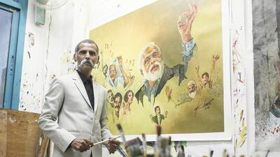 Akbar Saheb with his painting Mother Blessings, dedicated to the mother of prime minister Narendra Modi, Heeraben. The Dubai artist wants to present his artwork to the Indian leader as a gift during his visit to the UAE. Sarah Dea / The National