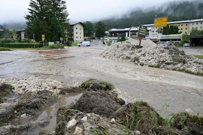 Water runs across an intersection after heavy rainfall and floods in Bavaria, southern Germany. AFP