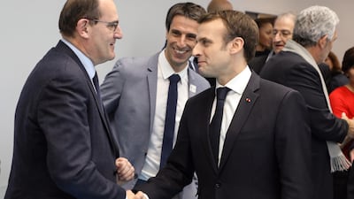 French President Emmanuel Macron (right) shakes hands with Jean Castex (left) in 2019. EPA