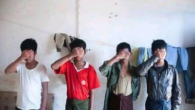 Child soldiers who deserted to the Kachin Independence Army protect their identities by covering their faces in their sleeping quarters in Laiza.