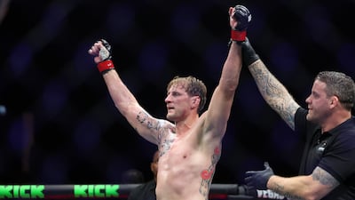 Alexander Volkov has his hands raised in victory after scoring a unanimous decision over Rizvan Kuniev.