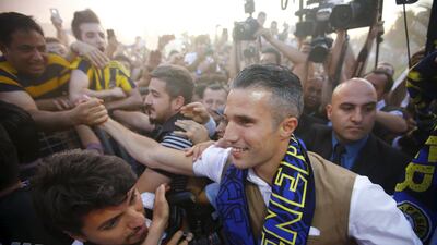 Robin van Persie arrives in Istanbul to be greeted by hundreds of Fenerbahce fans ahead of his move. Osman Orsal / Reuters