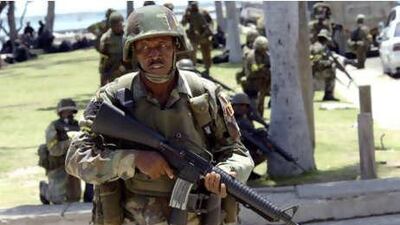 Jamaican soldiers patrol the streets of Kingston, Jamaica, in May, following unrest provoked by groups opposed to the arrest and extradition of the drug trafficker Christopher 'Dudus' Coke.