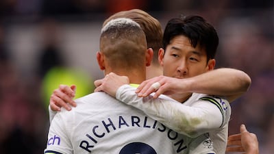 Son Heung-min celebrates scoring Tottenham's third goal with Harry Kane and Richarlison. Action Images