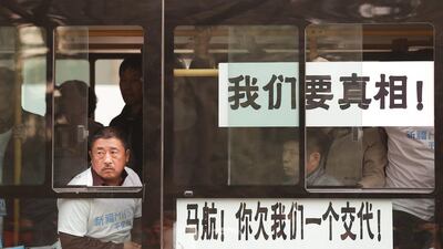 Hundreds of protesters, including many relatives of missing flight MH370 passengers, marched on the Malaysian Embassy in Beijing demanding answers from Malaysian authorities about the fate of the flight. Lintao Zhang / Getty Images