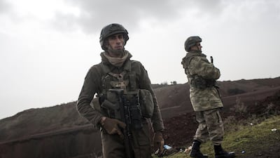 Turkish soldiers wait near the border ahead of the offensive against the Syrian-Kurd YPG militia, which has been named 'Operation Olive Branch'. Sedat Suna / EPA