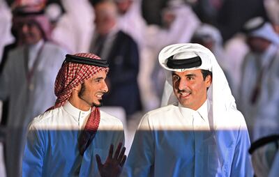 Sheikh Jassim bin Hamad Al Thani, left, pictured during the draw for the 2022 World Cup in Qatar at the Doha Exhibition and Convention Center on April 1, 2022. AFP