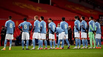 Manchester City players walk out in tribute No 8 shirts in memory of Colin Bell. PA