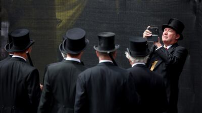 Guests pose for a photo ahead of the thanksgiving service for King Charles III in Edinburgh. PA