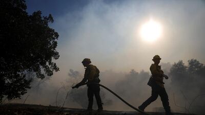 Firefighters battle the Peak Fire in Simi Valley. Reuters