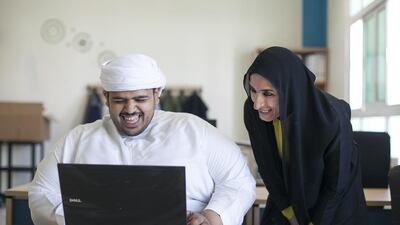 Humaid Al Mehri cannot hide his excitement as he shows Wedad Al Mubarak, head of activities at the Abu Dhabi Centre for Care and Rehabilitation, the email he has sent Sheikh Mohammed bin Zayed asking to meet him. Mona Al Marzooqi / The National