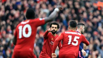 Liverpool's Mohamed Salah (centre) celebrates scoring against Bournemouth on March 7. PA