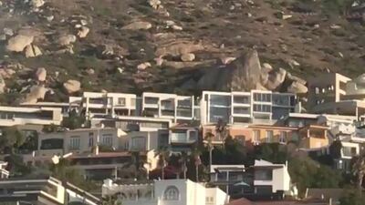 Smoke rises from a burning mountainside in Cape Town. Twitter /@Laura_Bodyzone / via Reuters