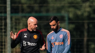 Manager Erik ten Hag speaks to Bruno Fernandes.
