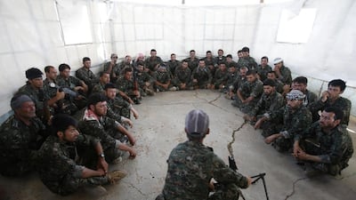 A relatives of senior Hamas commander Raed al-Atar, one of three senior Hamas commanders killed in an Israeli military strike, mourns during his funeral in the southern Gaza Strip town of Rafah. Israeli warplanes killed three top Hamas commanders in southern Gaza inflicting a heavy blow on the movement’s armed wing after failing to kill its top military chief. Mahmud Hams / AFP