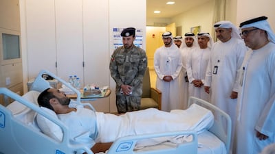 Maj Gen Ahmed Al Muhair, Abu Dhabi's police chief and head of the Abu Dhabi Emergencies, Crises Disasters Management Team, visits patients injured in the Iran war at Sheikh Shakhbout Medical City. Photo: Abu Dhabi Media Office