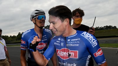 Alpecin–Deceuninck's Jasper Philipsen celebrates after winning Stage 4. Reuters