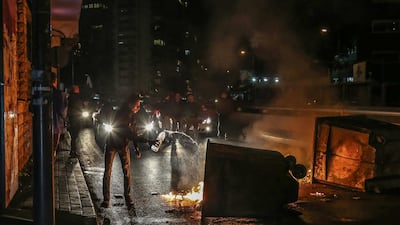 Supporters of Outgoing Prime Minister Saad Hariri close the road by burning waste during a protest against the newly appointed Lebanese Prime Minister Hassan Diab, at Al-Barbir neighborhood in Beirut. EPA