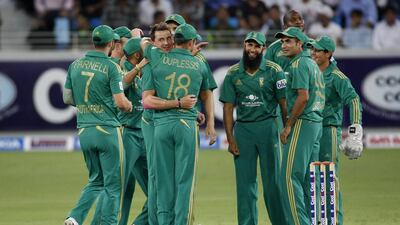 Dale Steyn, second from left, was the destroyer-in-chief as the fast bowler took three Pakistan wickets in Dubai on Wednesday. Asif Hassan / AFP