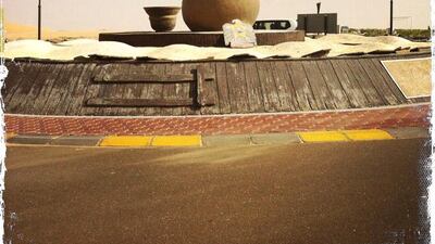 Day trip with friends to the Western Region and the Mazayin Dhafra Camel Festival, 220 kms west of Abu Dhabi on December 20, 2013. Traffic circle outside the Tilal Liwa Hotel. Picture taken with the Hipstamatic app for the iPhone. Liz Claus / The National