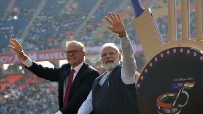 Indian Prime Minister Narendra Modi and Australia's Prime Minister Anthony Albanese wave to spectators at the Narendra Modi stadium in Ahmedabad. AFP