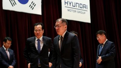 Chung Eui-sun, vice chairman of Hyundai Motor, centre, leaves a new year company meeting at the automaker's headquarters in Seoul. South Korea’s biggest automaking group forecast a slowdown in sales in 2018 as political risks dent demand for its vehicles in the world’s major markets. Photographer: SeongJoon Cho/Bloomberg