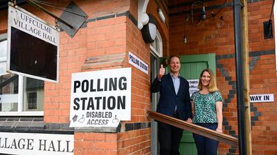 Liberal Democrat candidate Richard Foord and his wife Kate pose for photos outside the village hall polling station after casting their votes for the Tiverton and Honiton by-election. Getty Images