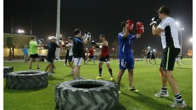Abu Dhabi Harlequins players are put through their paces during a training session.