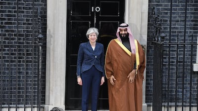 Saudi Crown Prince Mohammed bin Salman with Ms May on the steps of 10 Downing Street in March 2018