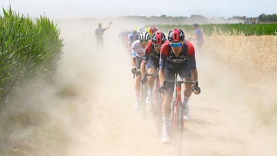 UAE Team Emirates team's Slovenian rider Tadej Pogacar (3rd R) wearing the best young rider's white jersey, Ineos Grenadiers team's British rider Geraint Thomas (2nd R) and Ineos Grenadiers team's Dutch rider Dylan Van Baarle (R) cycle across a cobblestone sector in the final kilometers of the 5th stage of the 109th edition of the Tour de France cycling race, 153,7 km between Lille and Arenberg Porte du Hainaut, in northern France. AFP