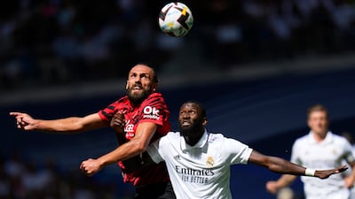 Mallorca's Vedat Muriqi and Antonio Rudiger of Real Madrid challenge for a header. AP