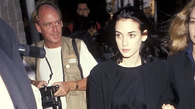 Winona Ryder in a black suit and oversized blazer attends the 'Backdraft' Beverly Hills premiere on May 22, 1991 at the Academy Theatre. Getty