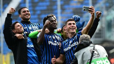 Ruslan Malinovskyi celebrates with Atalanta teammates after their Serie A victory over Juventus on Sunday, April 18. Getty