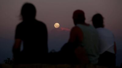 A 'super moon' rises over the Andes mountain range in Santiago, Chile. Pablo Sanhueza / Reuters.