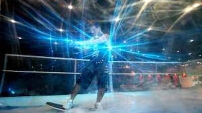 Arthur Beguet, an employee of Exploration Middle East, rides an artificial wave inside a wake box at the Abu Dhabi Exhibition Centre.