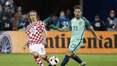 Portugal’s Adrien Silva in action with Croatia’s Luka Modric. Charles Platiau / Reuters