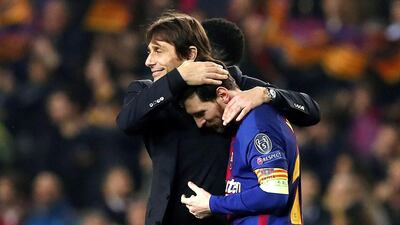 Chelsea manager Antonio Conte, left, congratulates Barcelona's Lionel Messi after the Argentine scored twice to knock Chelsea out of the Uefa Champions League round of 16. Alberto Estevez / EPA