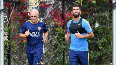 Arda Turan of Barcelona goes through a jogging session with a team trainer on Monday ahead of an International Champions Cup pre-season friendly against the LA Galaxy. Mark Ralston / AFP