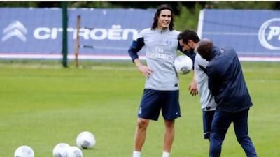 Paris Saint Germain’s Edinson Cavani, centre, was a key addition this summer and will boost the club’s chance of a repeat league title. Kenzo Tribouillard / AFP