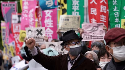 People chant slogans against government's decision to start releasing massive amounts of treated radioactive water from the wrecked Fukushima nuclear plant into the sea, during a rally outside the prime minister's office in Tokyo. AP