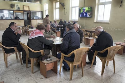Palestinian men, most who are Orthodox Christians, playing backgammon on a Friday morning at the Arab Orthodox Cultural Centre in the West Bank city of Beit Sahour near Bethlehem on January 18, 2019. Heidi Levine for The National.