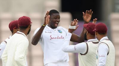 West Indies bowler Jason Holder celebrates taking the wicket of England's Jofra Archer. AFP