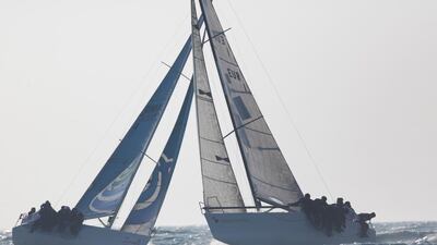 Team Messe Frankfurt and Team Renaissance fight it out during the Bahrain - Doha race of the EFG Sailing Arabia – The Tour 2014. Lloyd Images