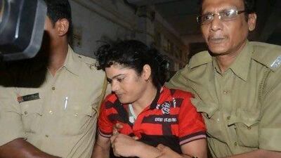 Police escort former Indian athlete Pinki Pramanik to the Barasat District court in near Kolkata. She appeared in court charged with raping her former lover who has alleged that she is actually a man.