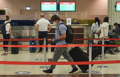 Passengers at Dubai International Airport on May 22, 2020. AFP / Karim Sahib