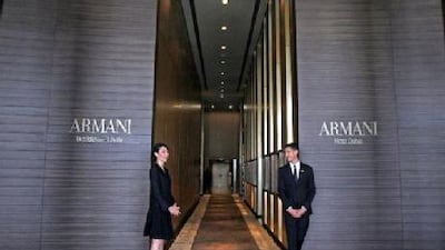 Hotel staff stand at the lobby of Armani hotel at Burj Khalifa in Dubai.