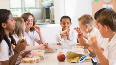 Schoolchildren enjoy their lunch, but even here there will be subtle comparisons made of each other's choices and packaging.